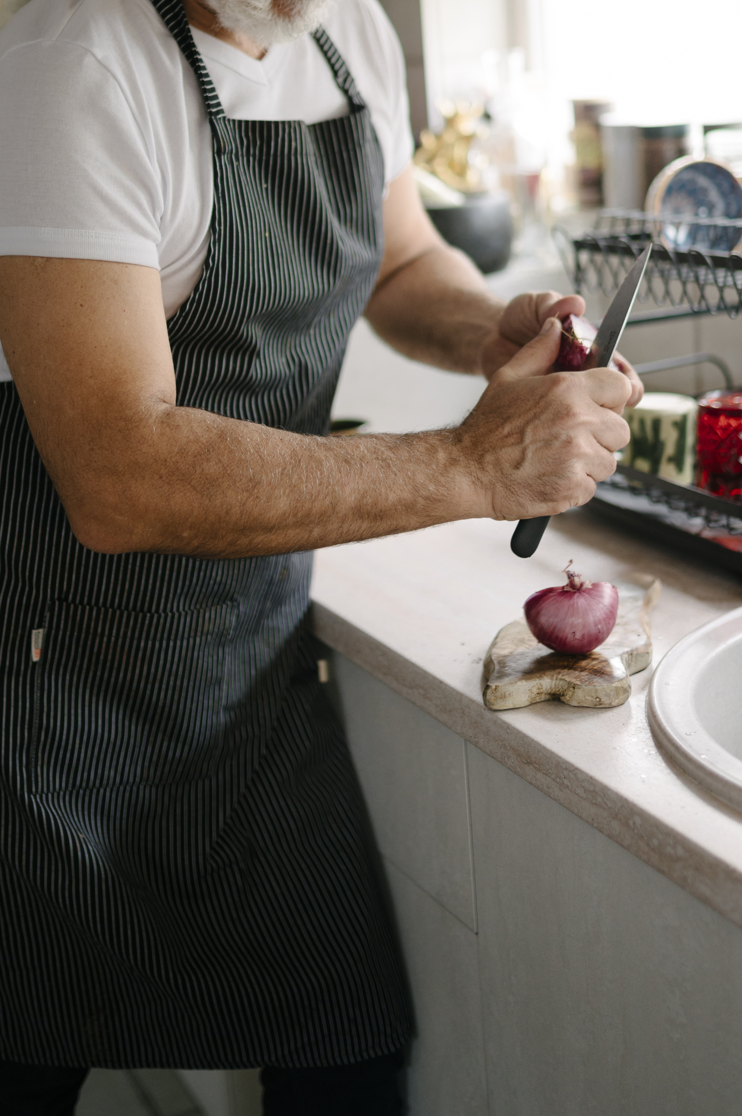 Black and white photo of a chef in a professional kitchen